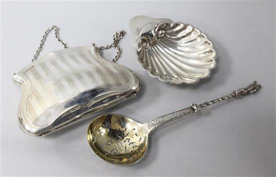 A silver purse, a silver butter shell and a continental white metal spoon.
